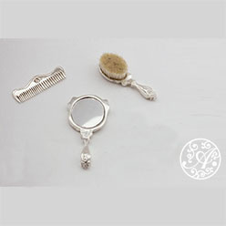 A white table with some silver objects on it